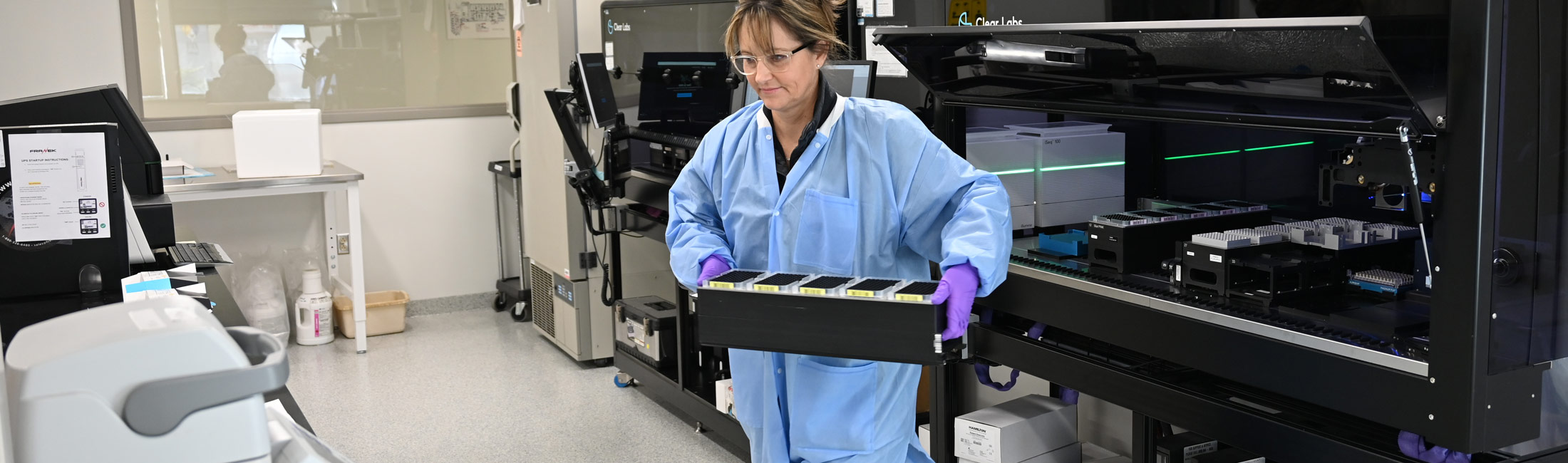 woman carrying tray from machine