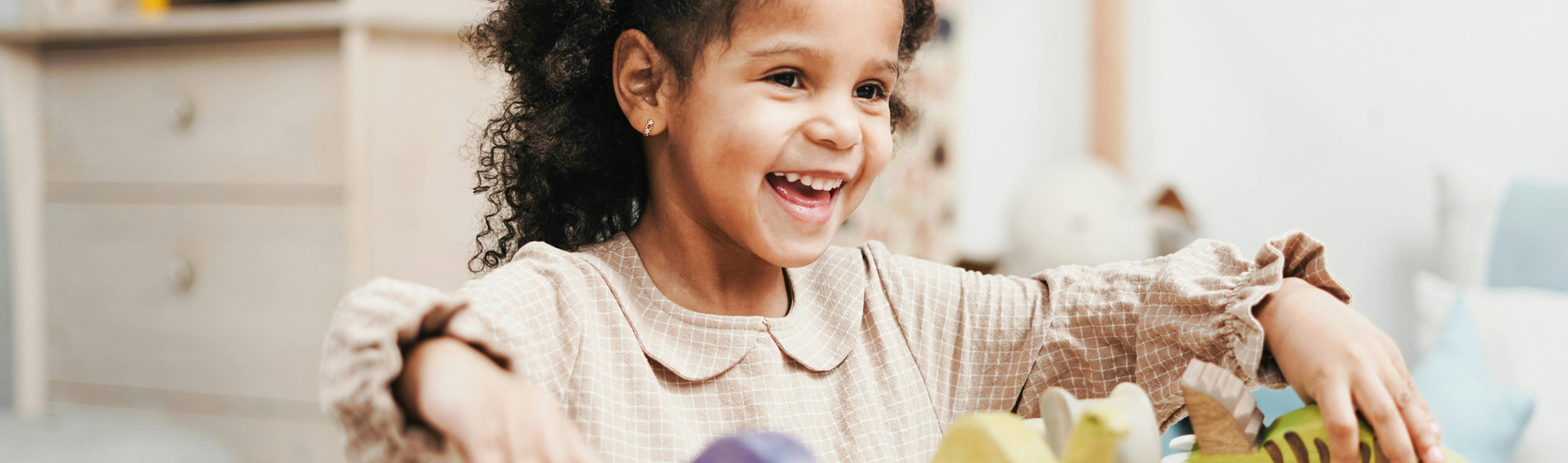 girl playing with toys