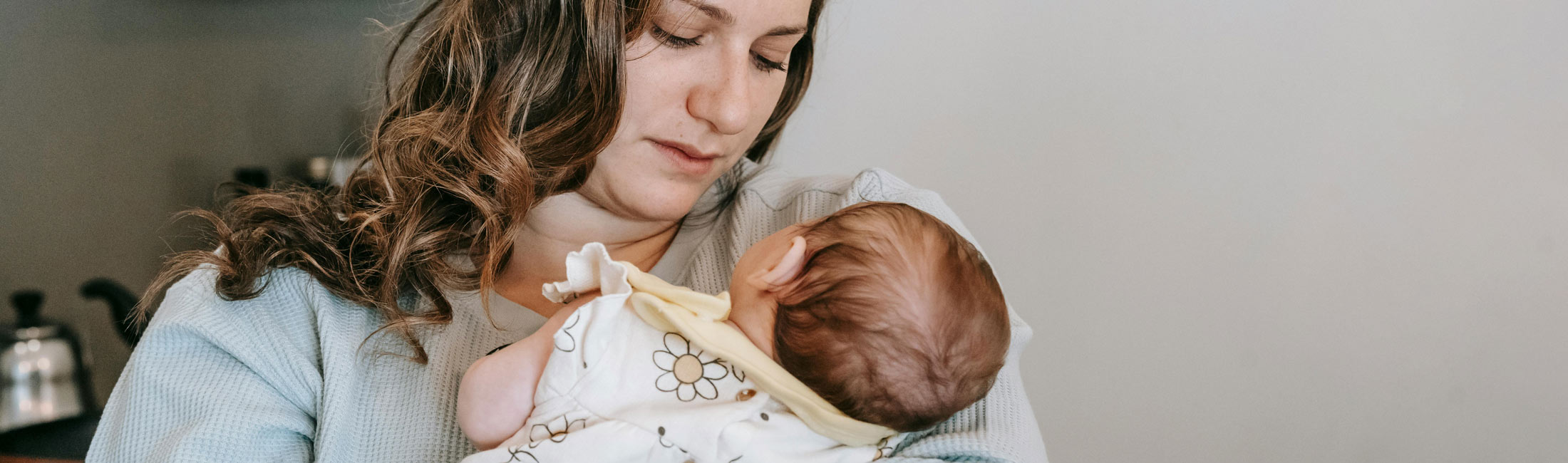 mother holding baby