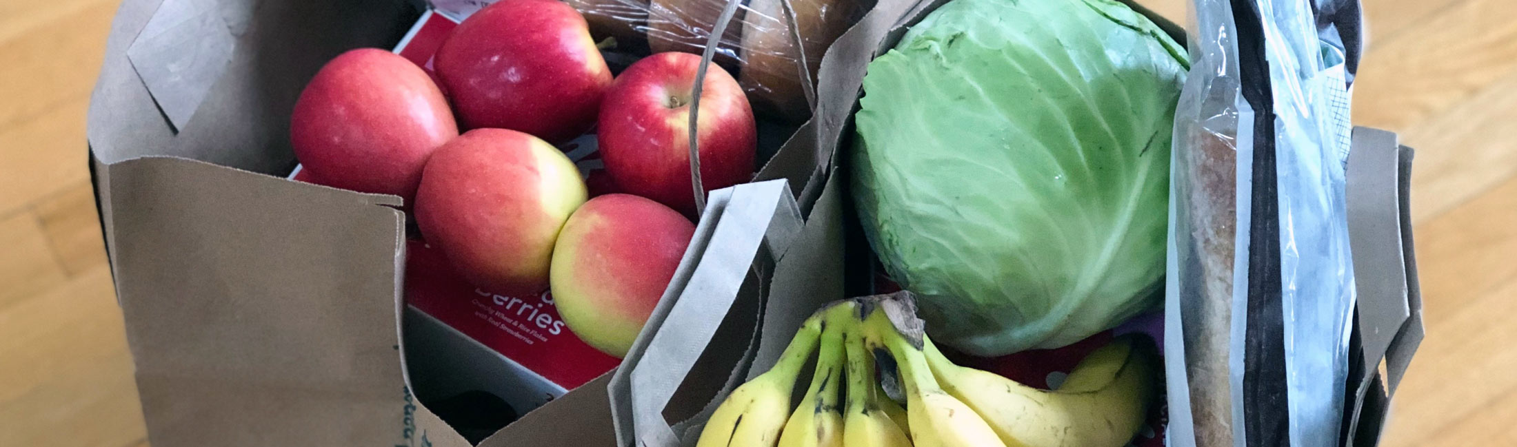 grocery bag of produce and food