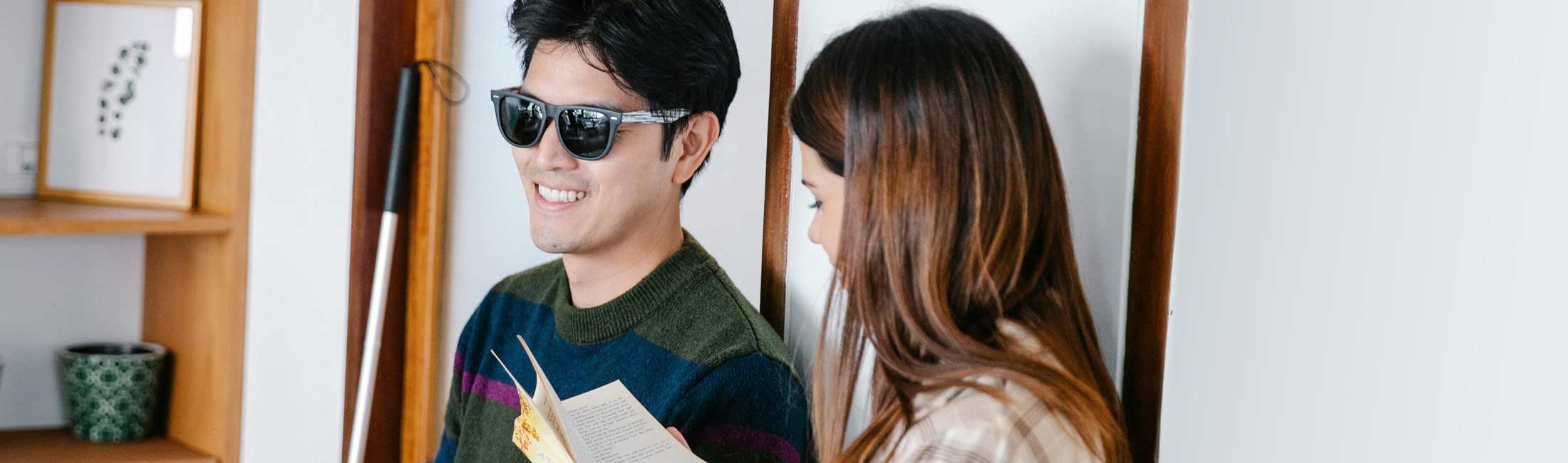Blind man and woman reading.