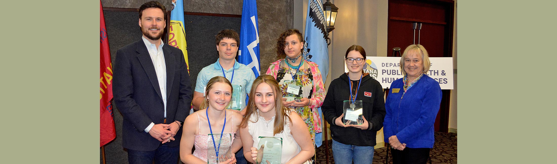 DPHHS Director Charlie Brereton and Lt. Governor Kristen Juras are the recipients of Youth Achievement of the Year award including Brooklyn Nunn, Taylor Gribble, Brandon Hogan, Lizzy McCullough, and Mary Jane Beaman