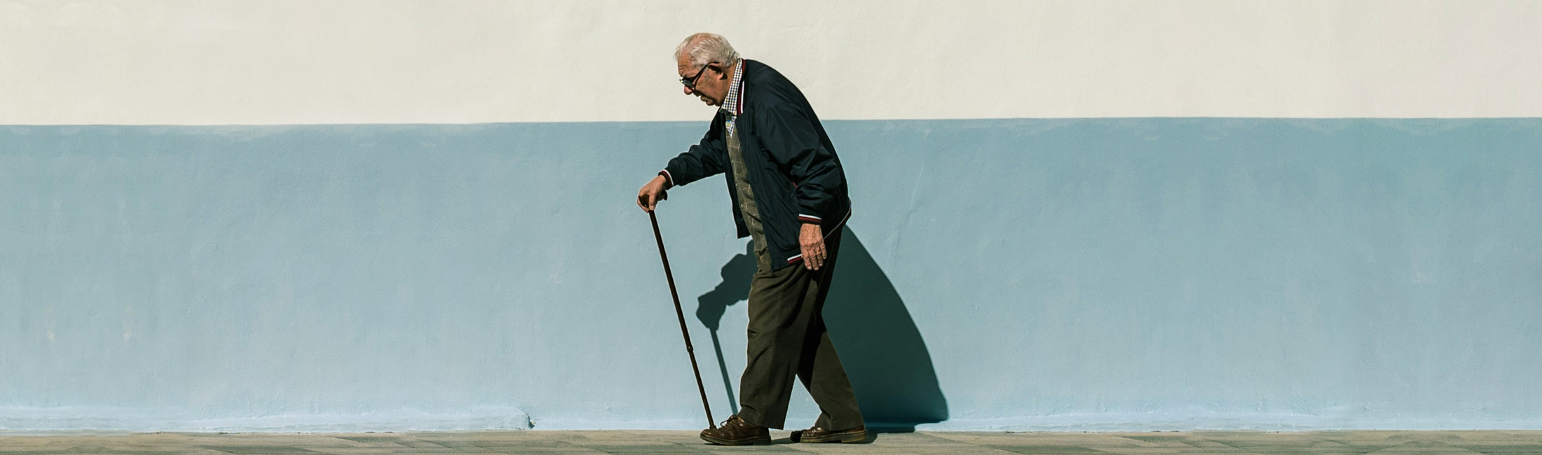 man walking with a cane