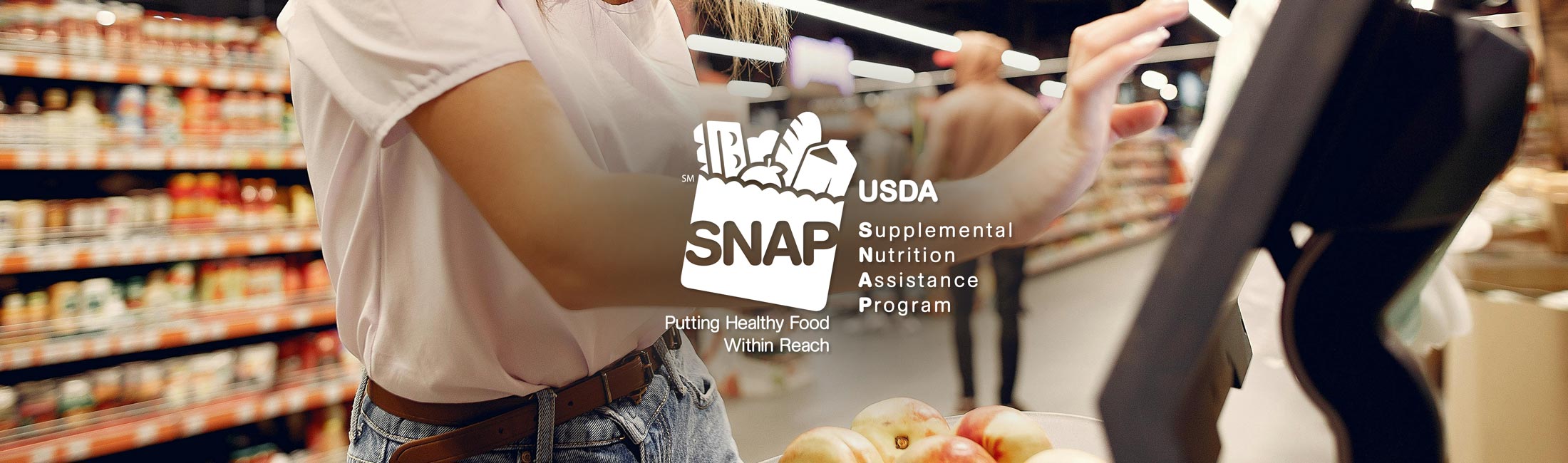 woman checking out at grocery store