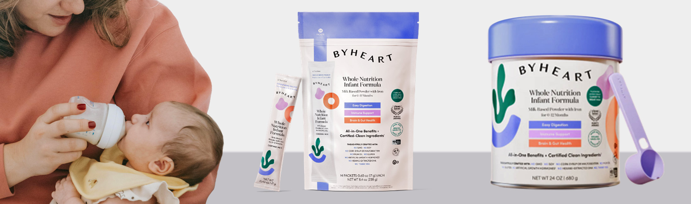 Woman feeding baby bottle with images of recalled packaging for By Heart formula