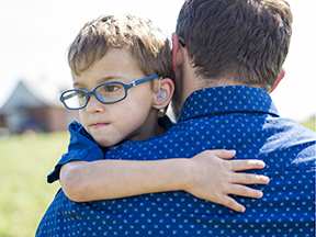  Man holding son