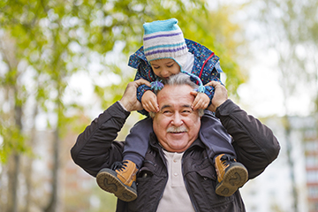 Man with child on his shoulders